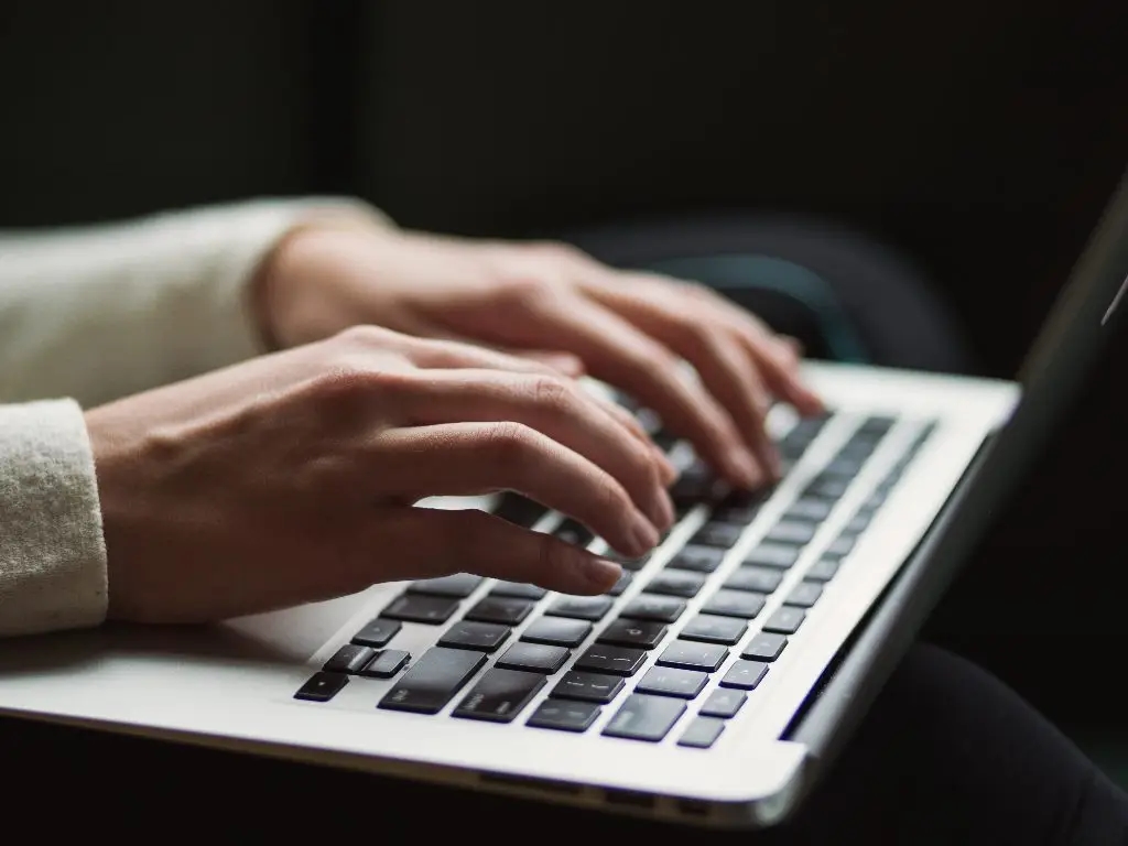 person typing on computer