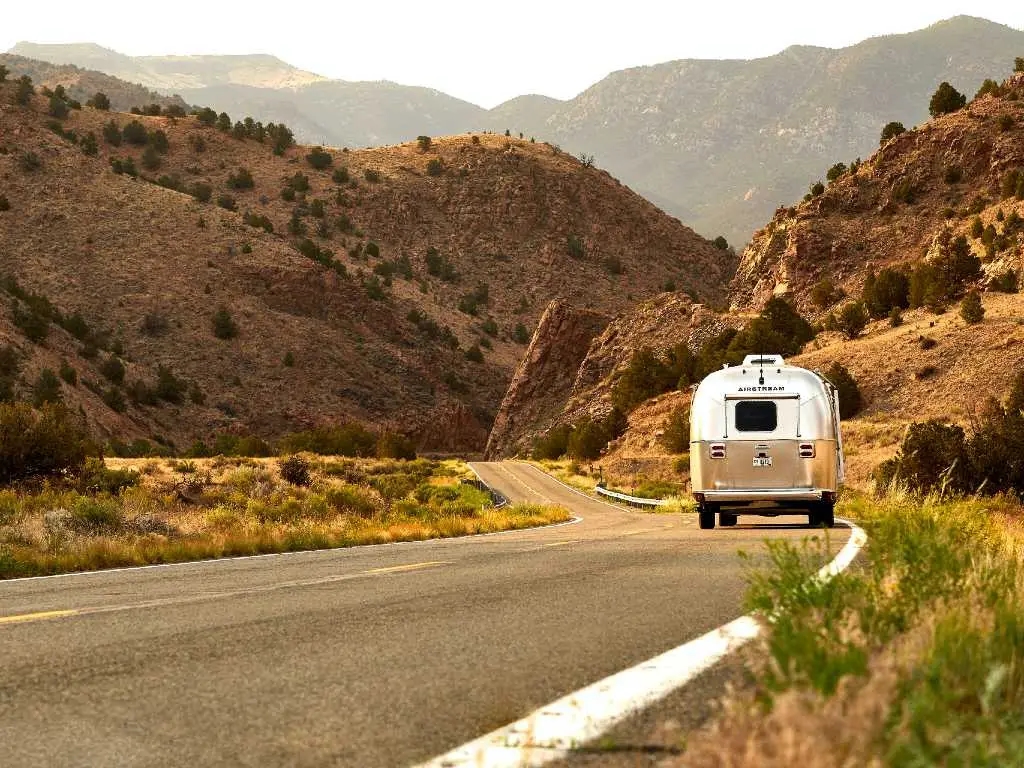 rv driving down a mountain road.